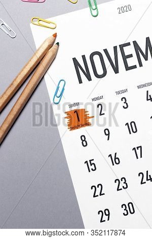 Daylight Saving Day Marked On November 2020 Calendar With Office Supplies