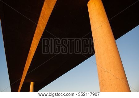 Concrete Bridge Over Highway At Sunset. Horizontal Image