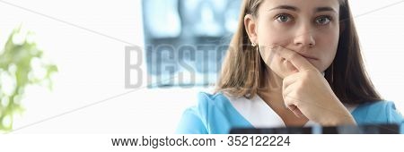 Portrait Of Intern Practicing In Hospital. Beautiful Inexperienced Woman Trying Making Diagnoses Fro