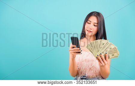 Smiling Face Portrait Asian Beautiful Woman Her Usring Mobile Smart Phone And Holding Bunch Money Lo