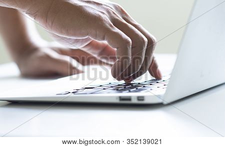 Hand Man Typing On Computer Laptop By Using Index Finger, Use A Computer To Gain Unauthorized Access