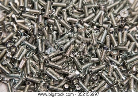 M6 Metal Screws Galvanized White In Bulk Closeup In The Studio
