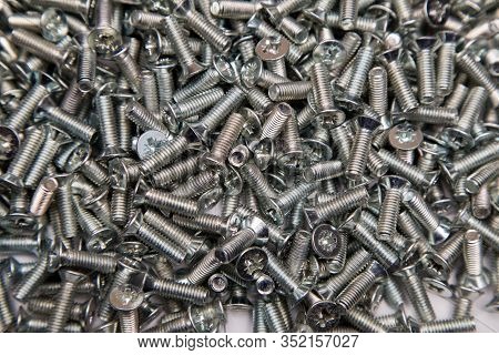M6 Metal Screws Galvanized White In Bulk Closeup In The Studio