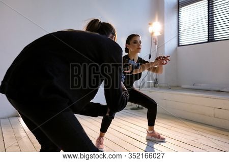 Professional Filmmaking In A Studio With Model. Video About Sport And Fitness, Healthy Lifestyle. Mo
