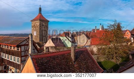 Aerial View From Town Wall Of Weisser Turm And Quaint Colorful Facades And Roofs Of Medieval Old Tow