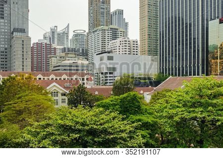 Business district view from the Lupini park in Bangkok, Thailand