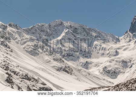 Natural Monument El Morado, Central Andes Of Chile. A Snowy Rocky Mountain