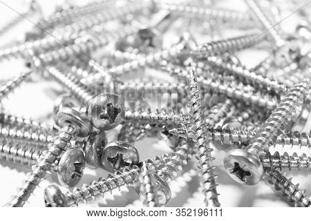 Self Tapping Metal Screw  Background. Macro Shot Of A Self-tapping Screws. Background Of The Screw.