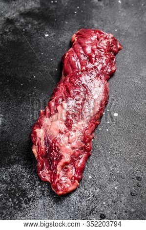 Raw Top Blade, Denver Steak. Black Background. Top View.