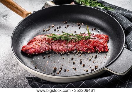 Raw Skirt, Machete Steak In A Pan With Cooking Ingredients. Gray Background. Top View