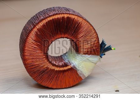 Close-up Of A Toroidal Transformer, Made Up Of Wrapped Copper Coil