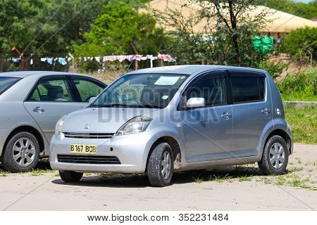 Maun, Botswana - February 10, 2020: Grey Compact Car Toyota Passo In The Town Street.