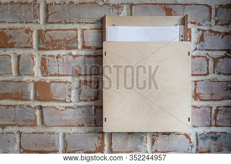 Old Vintage Brick Wall With Plywood Box For Anonymous Paper Notice, Feedback, Suggestion , Opinions 