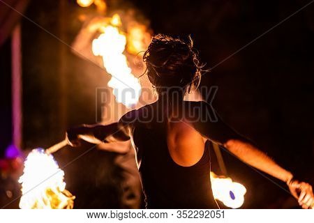 Professional Fire Dancers Put On A Show During Event Celebrating Nature And Peace, Swinging Rope And