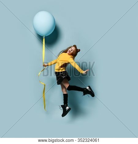 Ginger Teenager With Fancy Hairstyle In Yellow Sweatshirt, Black Skirt, Knee-highs, Boots. Smiling, 