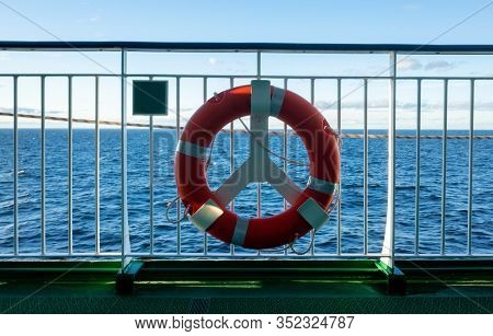 Lifebuoy On The Railing Of One Of The Decks Of A Tourist Ferry