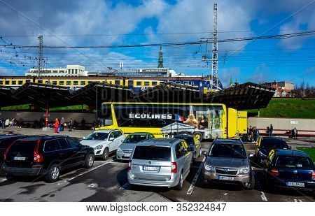 April 26, 2018 Riga, Latvia. Yellow Passenger Bus Of The Ecolines Company At The Bus Station In Riga