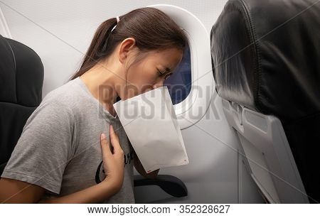 Female Passenger On The Plane Felt Airsick, Affected With Nausea Due To Travel In An Aircraft Using 