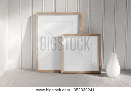 Two Portrait And Square Wooden Frame Mockups. Linen Cloth And Modern Ceramic Vase With In Sunlight. 