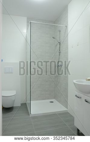 Bathroom With Walk-in Shower In New Apartment In Wroclaw, Poland. Studio Type Apartment With Area Of