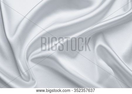 Elegant Light Gray Fabric Backgrounds. Metallic Grey Color Of Shiny Textile, Soft Silver Texture. Sa