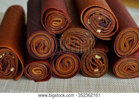 Sweet Pureed Fruit Pastille. Fruit Roll-ups Homemade. Natural Sweets From Dried Berries And Fruits. 