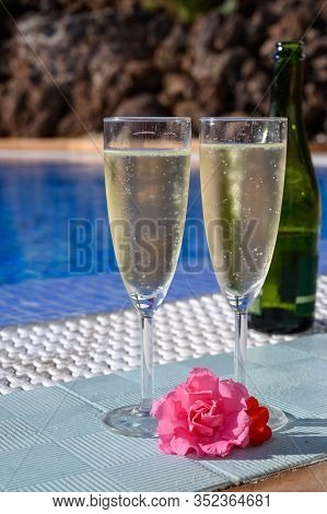 Pool Party With Two Glasses Of Bubbles White Champagne Or Cava Wine, Romantic Event On All Inclusive