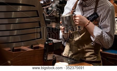 Shanghai, China - January 11, 2020: A Starbucks Barista Making Coffee For Their Customer At The Star