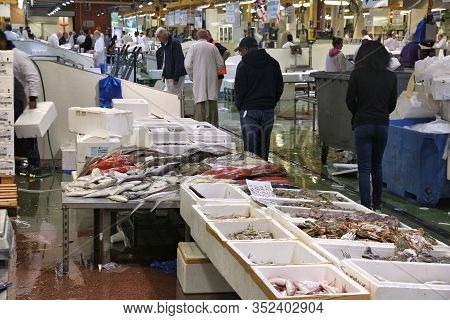 London, Uk - July 8, 2016: Vendors Sell Sea Food At Billingsgate Fish Market In London, Uk. The Mark