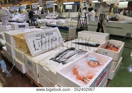 London, Uk - July 8, 2016: Vendors Sell Sea Food At Billingsgate Fish Market In London, Uk. The Mark
