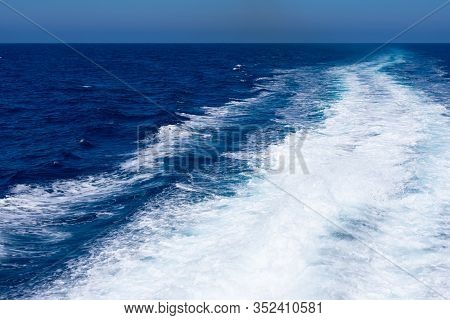 Background Made Of Clear Sea Water Surface With Kelvou Jet, Bubbles And Waves On Water Surface With 
