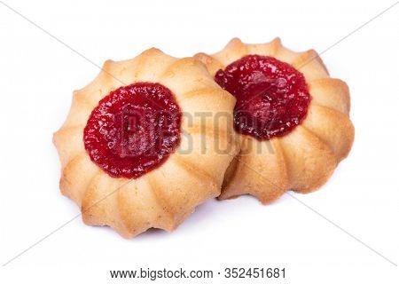 Group of shortbread cookies with a drop of jam, curabier dessert isolated on white background