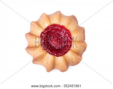 One shortbread cookie with a drop of jam, curabier dessert isolated on white background