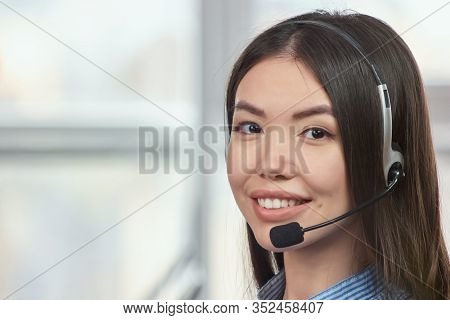 Face Of Japaneese Girl With Headset. Portrait Of Young Beautiful Female Call Center Operator, Close-