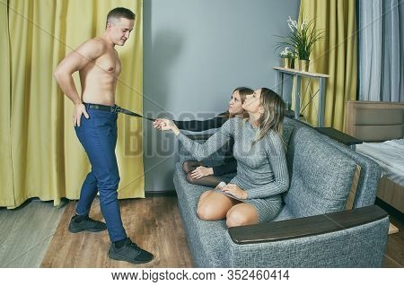 Striptease Performer Entertains Two Young Women.