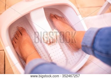 Female Feet In Foot Bath Tub