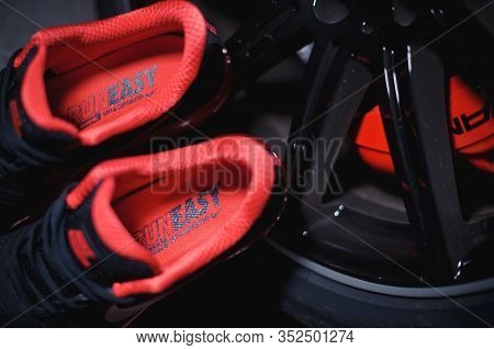 Perfect Nike Air Max 2017 Sport Shoes Shot Near The Mercedez Benz Car On Dark Background. Sport And