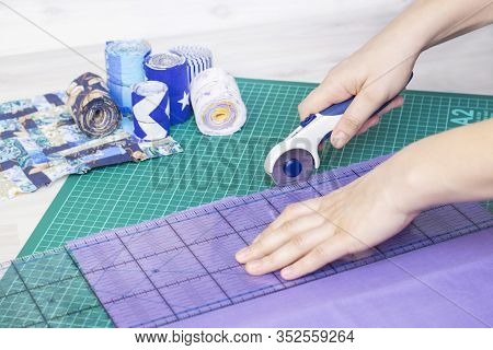Fragments Of A Quilt, Accessories For Patchwork. The Seamstresss Hand Cuts The Fabric For The Quilt.