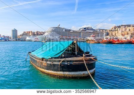 Boat In The Fair Harbor On Background Cruise Ship In Italian Harbor Genoa, Italy - March 9, 2019