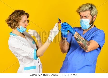Injection In Hospital. Stop Coronavirus. Virus Infection Injection Vaccine. Doctors Wear Respirator 