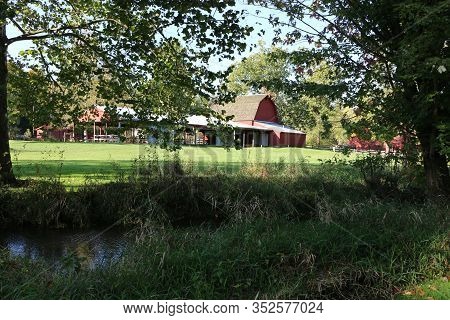Midwest Farm Barn Buildings Next To A River
