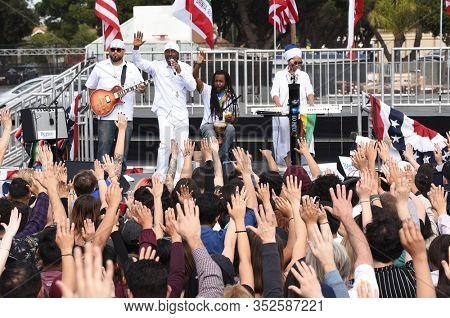 SANTA ANA, CALIFORNIA - 21 FEB 2020: Reggae singer Pato Banton and band perform at a Bernie Sanders Rally at Santa Ana Valley High School.