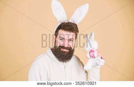 Easter Activities Concept. Still Childish. Celebrate Easter. Guy Bearded Hipster Cheerful Bunny With