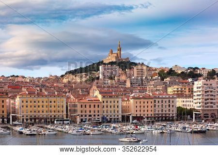The Old Vieux Port And Basilica Notre Dame De La Garde In The Historical City Center Of Marseilles O