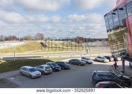 City Riga, Latvia. Supermarket Facade And Yard With Cars.