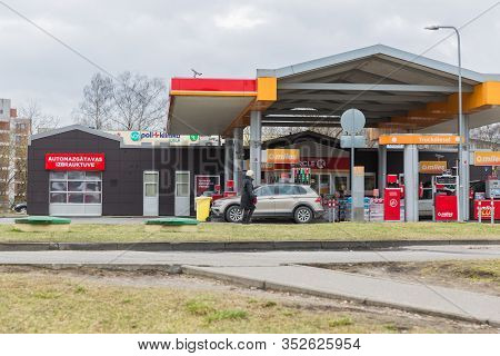City Riga, Latvia. Petrol Tank With Fueled Cars. Car Wash And Shop.