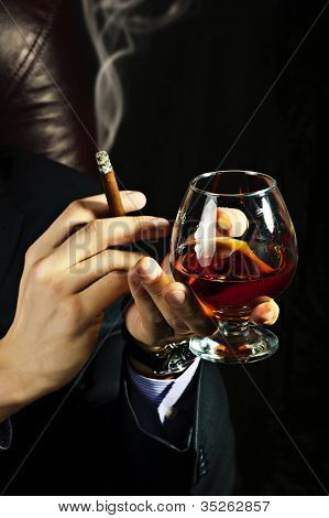 Brandy Glass At Male Hand, Smoking Cigar