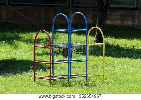 Partially Rusted Colorful Climbing Retro Vintage Outdoor Public Playground Equipment Surrounded With