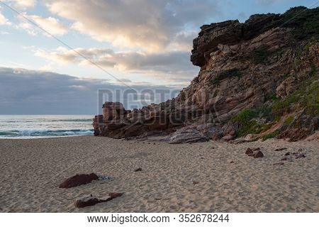 Praia Do Amado Beach At Sunset In Costa Vicentina, Portugal
