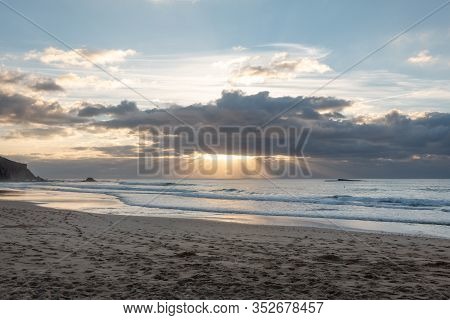 Praia Do Amado Beach At Sunset In Costa Vicentina, Portugal